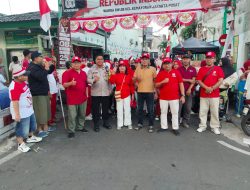HUT RI ke-80, Bhabinkamtibmas Kawal Gerak Jalan Santai di Kemayoran